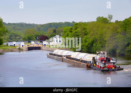 CANAJOHARIE, NY/USA - MAY 24 2017: Huge aluminum beer tanks made in China are shipped up the Erie Canal. Destination: Genesee Brewery in Rochester, NY Stock Photo