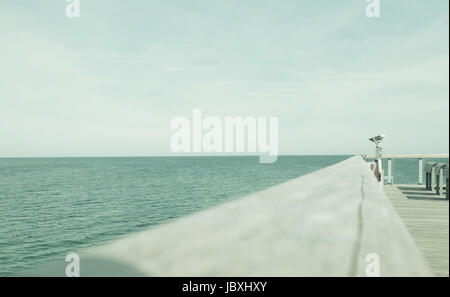 Binoculars on a sea bridge at the Baltic sea, selective focus on the binoculars, using as background with space for text Stock Photo