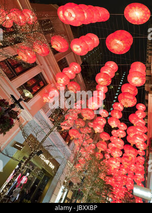 Vertical view of Chinese New Year decorations lit up at night at the controversial Lee Tung Street urban renewal development in Hong Kong, China. Stock Photo