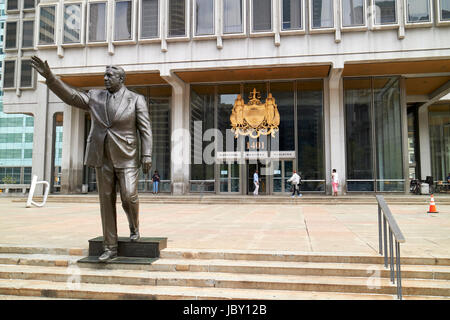 frank rizzo statue and big seal of the city on municipal services building Philadelphia USA Stock Photo