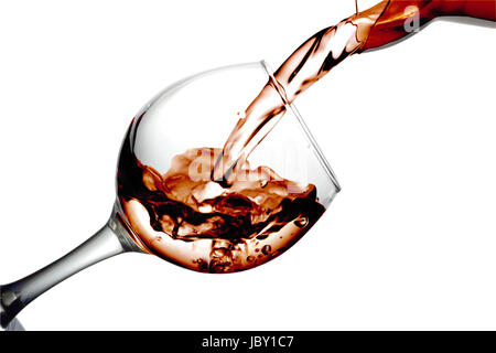 Red liquid, water, cherry juice, strawberry juice, red wine pouring into a glass, liquid in a speaker, isolated on a white background Stock Photo