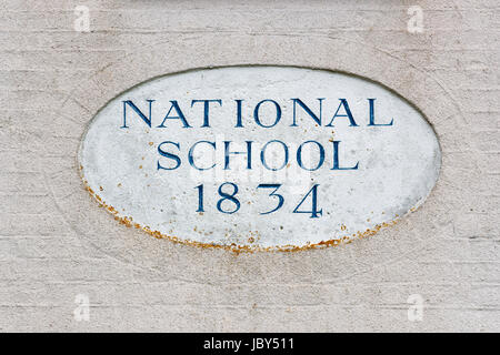 National school building 1834, commemorative plaque, Bosham, a coastal village on the south coast near Chichester, West Sussex, southern England, UK Stock Photo