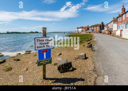 Seafront road, floods at high tide, Bosham, a south coast coastal village in Chichester Harbour near Chichester West Sussex, southern England, UK Stock Photo