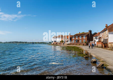 Rising tide flooding the seafront access road, Bosham, a south coast coastal village in Chichester Harbour, West Sussex, southern England, UK Stock Photo