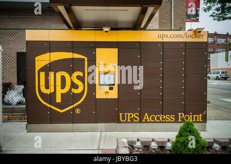A UPS Access Point pick-up station in outside of a gas station in the Greenpoint neighborhood of New York on Sunday, June 4, 2017. The lockers enable customers, who work and do not have doorman or another party, to receive their purchase in a secure location. Amazon has had a similar network of lockers for several years. (© Richard B. Levine) Stock Photo