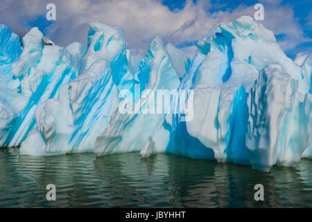 Blue shimmering beautiful iceberg in Antarctica Stock Photo