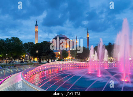 colorful fountain in front of the hagia sofia mosque in istanbul. The building is on the World Heritage List of UNESCO, and nowadays in use as a museum Stock Photo