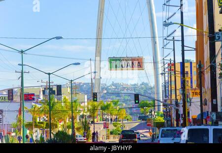 The Millennial Arch (Arco y Reloj Monumental), a metallic steel arch at the entrance of the city of Tijuana in Mexico, at zona centro a symbol of union and vigor to the new millennium and a landmark that welcomes tourists in Avenida de revolucion with a sign that reads Bienvenidos a Tijuana. Stock Photo