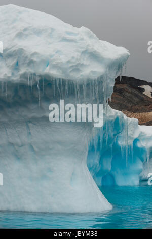 Blue shimmering beautiful iceberg in Antarctica Stock Photo