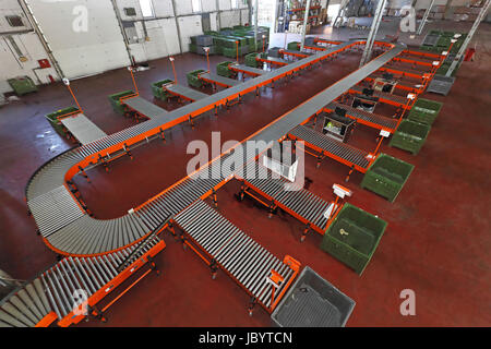 Sorting system with conveyer belt in distribution warehouse Stock Photo