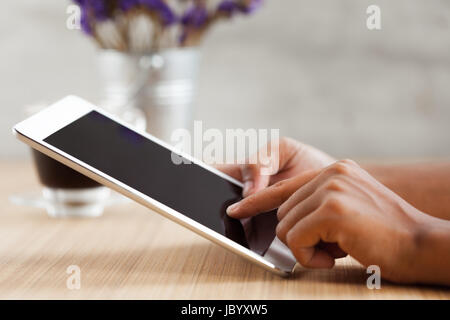 close-up hand touching on digital tablet Stock Photo
