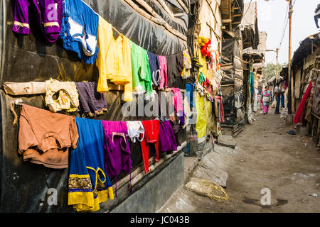 Laundry is put to dry between slum dwellings in Topsia slum Stock Photo