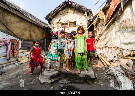 Children are playing between slum dwellings in Topsia slum Stock Photo