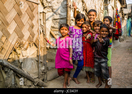 Children are playing between slum dwellings in Topsia slum Stock Photo