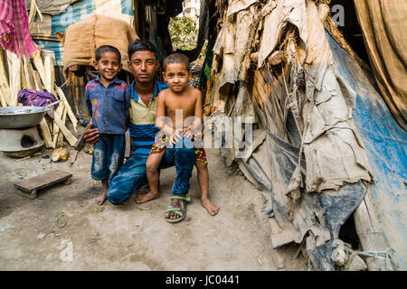 Children are playing between slum dwellings in Topsia slum Stock Photo