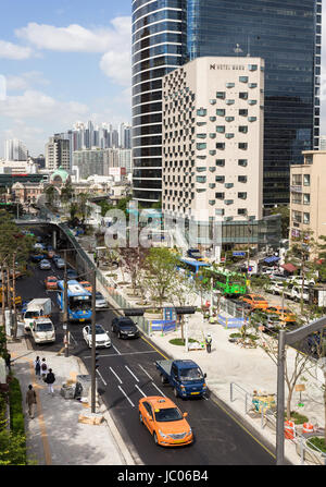 SEOUL, SOUTH KOREA - MAY 15: Cars and buses drive along the road leading to Seoul train station in the downtonw district of the South Korea capital ci Stock Photo