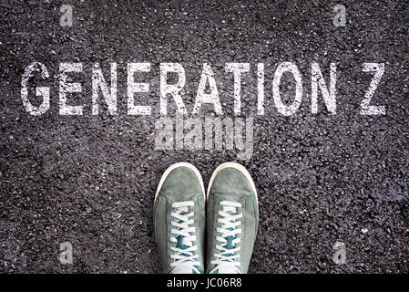 Text Generation Z written on asphalt with shoes, generation Z concept Stock Photo