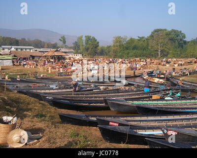 Boats at a market on the banks of Inle lake Myanmar Stock Photo