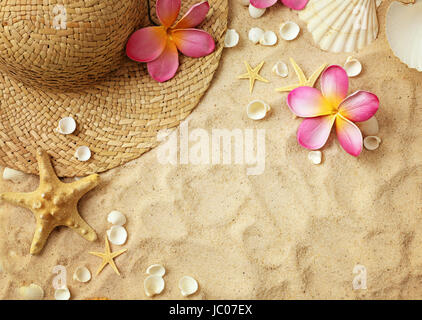 summer hat and seashells on sand. summer frame background Stock Photo