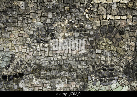 Handmade glass tiles in urban walls, decoration and construction Stock Photo