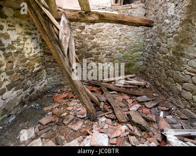 Roof caved in with debris. Only sky above. Stock Photo