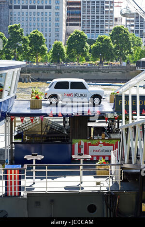 Pimms advertising on a Mini car on-board Tattershall Castle floating restaurant moored up to the Victoria Embankment on the River Thames in London Stock Photo