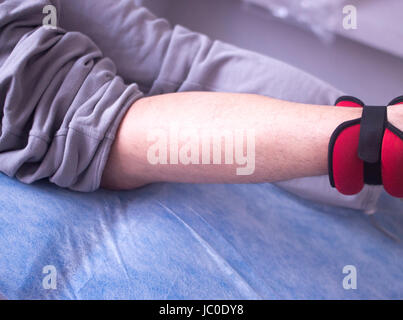 Physical therapy mecical clinic physiotherapy treatment for knee injury and rehabilitation after surgery. Stock Photo