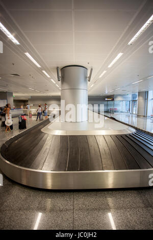 Perspective view on luggage claim line at airport terminal Stock Photo