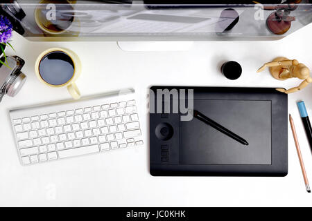 Designer desk , Stylish workspace with computer , creative stuff on home or studio. Stock Photo