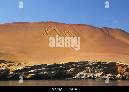 Candelabra of the Andes in Pisco Bay, Peru. Candelabra is a well-known prehistoric geoglyph found on the northern face of the Paracas Peninsula Stock Photo