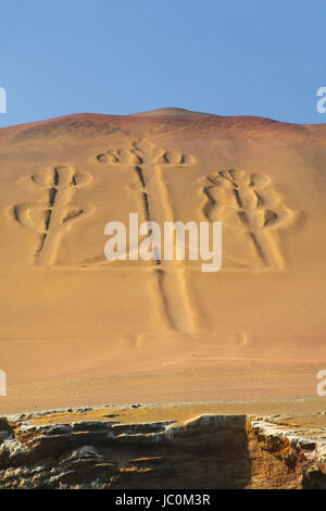 Candelabra of the Andes in Pisco Bay, Peru. Candelabra is a well-known prehistoric geoglyph found on the northern face of the Paracas Peninsula Stock Photo