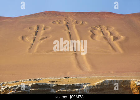 Candelabra of the Andes in Pisco Bay, Peru. Candelabra is a well-known prehistoric geoglyph found on the northern face of the Paracas Peninsula Stock Photo