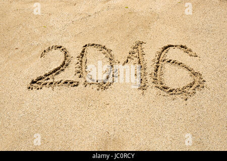 2016 digits written on wet sand at beach Stock Photo
