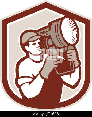 Illustration of a electrical lighting technician crew carry fresnel spotlight on shoulder looking to side set inside shield crest shape on isolated background done in retro style. Stock Photo