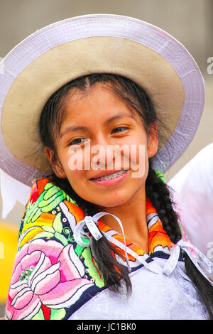 Portrait of a young woman performing during Festival of the Virgin de la Candelaria in Lima, Peru. The core of the festival is dancing and music perfo Stock Photo