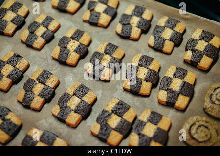 Many checker cookie on the tray. Stock Photo