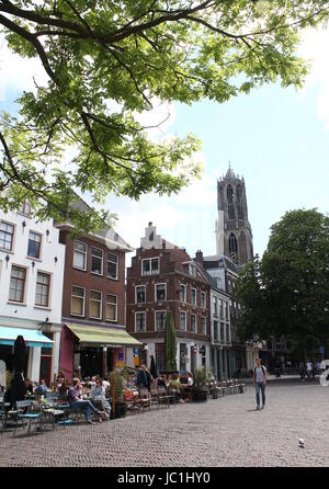 Medieval square at Ganzenmarkt and Korte Minrebroederstraat in the historic city centre of Utrecht, The Netherlands. Dom church tower in background. Stock Photo