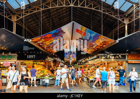 BARCELONA, SPAIN - AUGUST 05, 2016: People In Barcelona Market (Mercat de Sant Josep de la Boqueria), a large public market and a tourist landmark wit Stock Photo