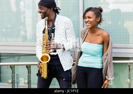 African couple playing Saxophone Stock Photo