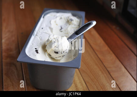 Homemade Organic Vanilla ice cream scoop, scooped out of a container Stock Photo