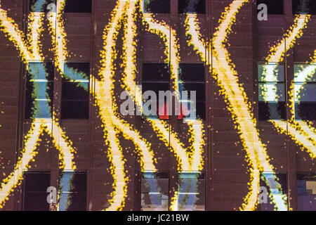 Sydney, Australia. 13th June, 2017. Vivid Sydney Light Festival on the 13th of June. The Vivid Sydney Light festival will run from the 26th of May through to the 17th of June and is one of the largest festivals of its kind in the world. Pictured is the light installation 'Organic Vibrations' projected on the Museum of Contemporary Art Australia (MCA). Credit: mjmediabox/Alamy Live News Stock Photo