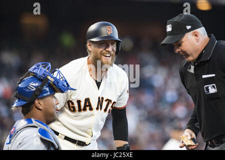 San Francisco, California, USA. 13th June, 2017. San Francisco Giants right fielder Hunter Pence (8) steps up to bat and has a laugh with Kansas City Royals catcher Salvador Perez (13) and umpire Tim Timmons (95) during a MLB baseball game between the Kansas City Royals and the San Francisco Giants on ''Say Hey Tuesday'' at AT&T Park in San Francisco, California. Valerie Shoaps/CSM/Alamy Live News Stock Photo