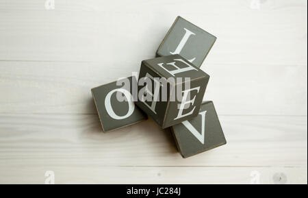 Word love written wooden blocks. Concept of building love Stock Photo