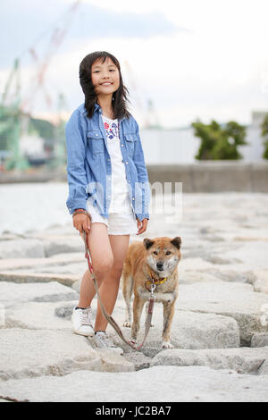 Girl and Shiba Inu Stock Photo