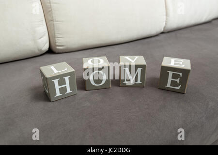 Conceptual photo of word home and love written on toy bricks Stock Photo