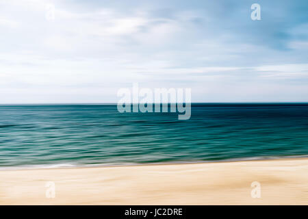 View of the beach, sea and blue sky, abstract seascape in blur Stock Photo