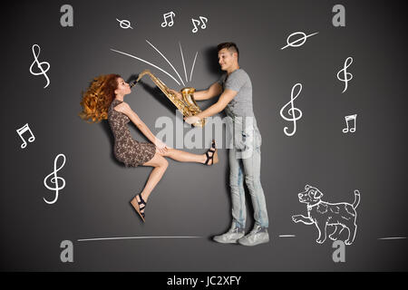 Happy valentines love story concept of a romantic couple against chalk  drawings background. Male pole dancing on a lamppost while walking with  girlfriend Stock Photo - Alamy