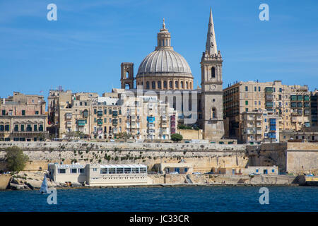 Skyline of Valetta, capital of Malta, dome of the Carmelite church and steeple of St. Paul's Anglican Pro Cathedral Church, Stock Photo