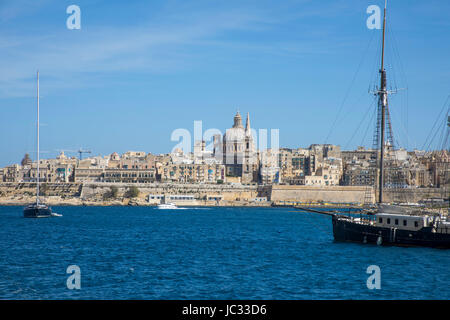 Skyline of Valetta, capital of Malta, dome of the Carmelite church and steeple of St. Paul's Anglican Pro Cathedral Church, Stock Photo