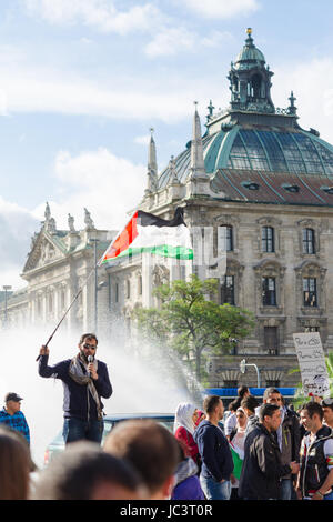 MUNICH, GERMANY - AUGUST 16, 2014: Palestinian demonstration in the center of the European Union. The protesters are demanding the release of the occupied Palestinian territories and the withdrawal from the Gaza Strip. Stock Photo